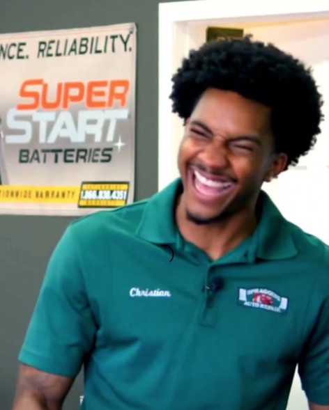 Christian, a Spraggins Auto Repair technician, laughing during a video about vehicle drop-off trust